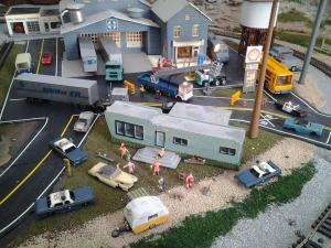 This is a scene from my dad's train layout that he's titled "Family Gathering." Thankfully, our family gathering this weekend required no police cars.